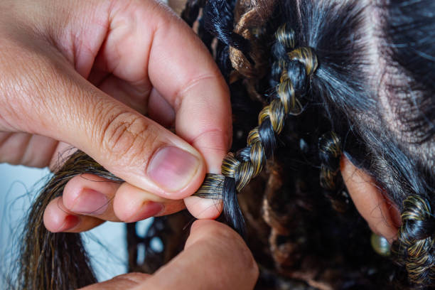 Braiding hair at the beauty salon