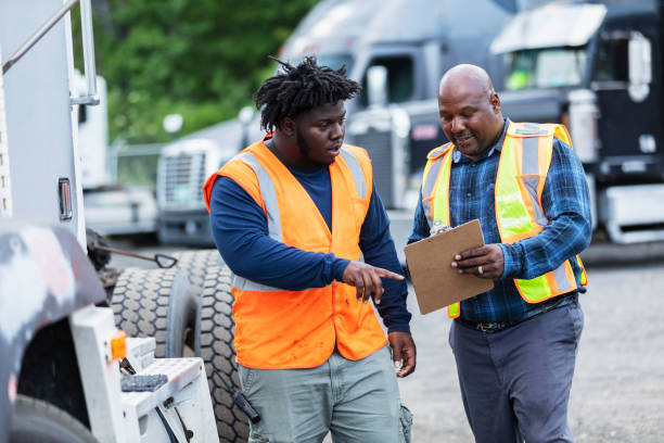 istock Father, son working at trucking company, with clipboard 2170405714