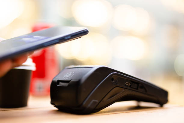 istock Customer paying with mobile phone in a bar 2170411047