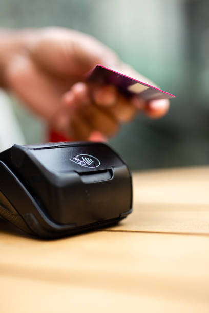 istock Man paying with credit card in a cafe 2170411060