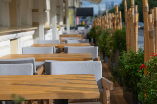 istock Empty wooden tables in street restaurant 2170413580
