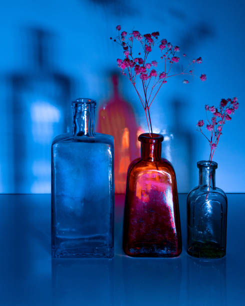 Copy space Medical red and blue vial with injection solution on a white background.