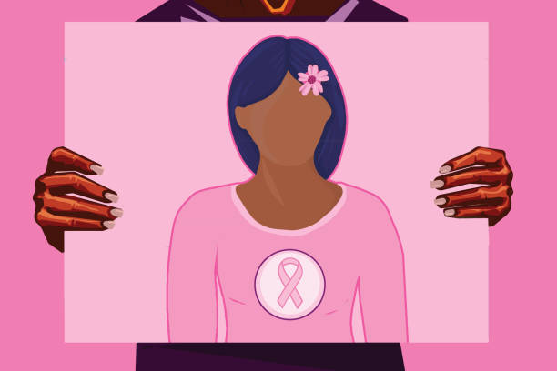 Afro-American woman holding a print for breast cancer month