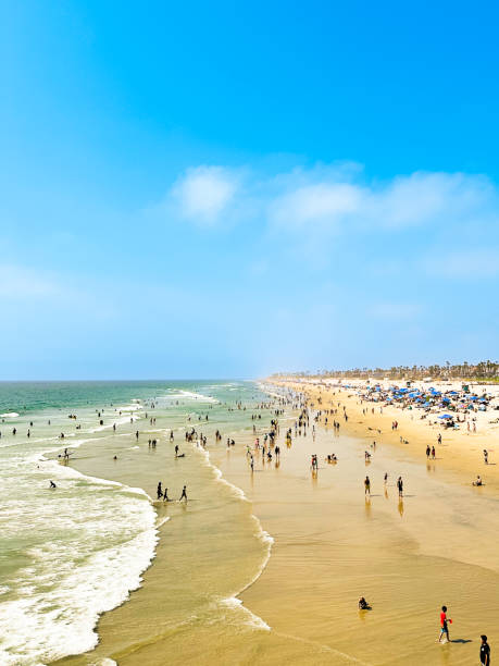 istock Vibrant Beach Scene with Crowd Enjoying Waves, Sunbathing and Soaking Up the Sun 2170418815