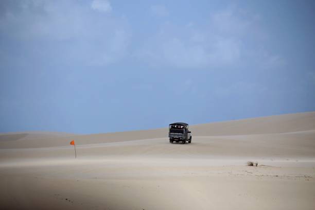 istock Off road vehicle going up sand hill on desert 2170425385