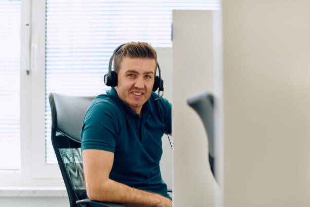 istock Close Up Portrait of a Customer Support Representative in a Call Center Environment. 2170426075