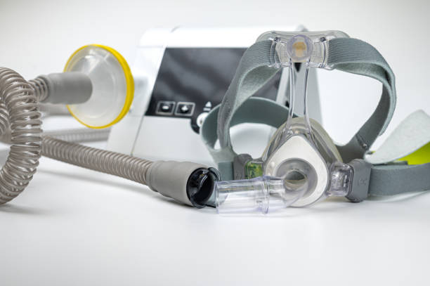 istock Continuous positive airway pressure system includes of CPAP machine, mask, tube on white background. 2170427592