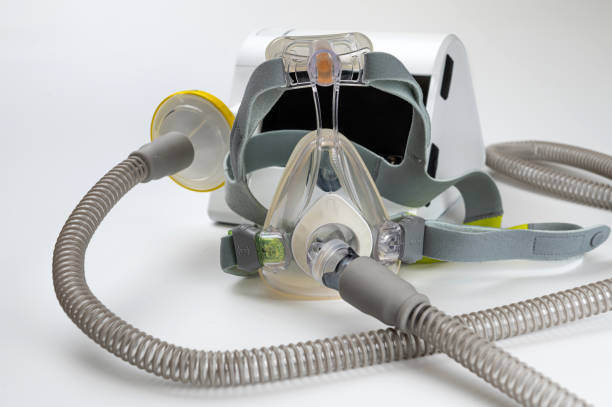 istock Continuous positive airway pressure system includes of CPAP machine, mask, tube on white background. 2170427605