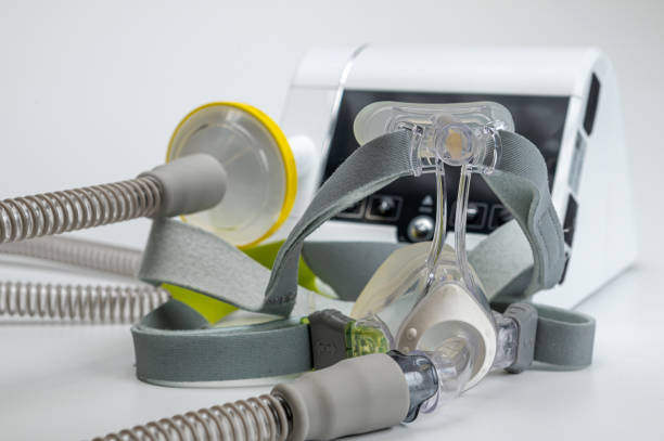 istock Continuous positive airway pressure system includes of CPAP machine, mask, tube on white background. 2170427632