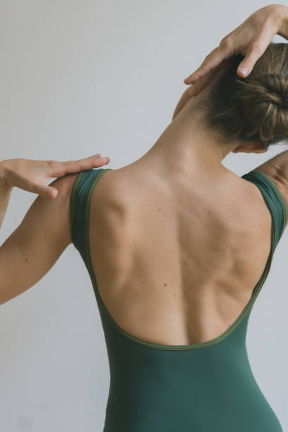 istock Young woman performs home fitness routine, Pilates 2170435444