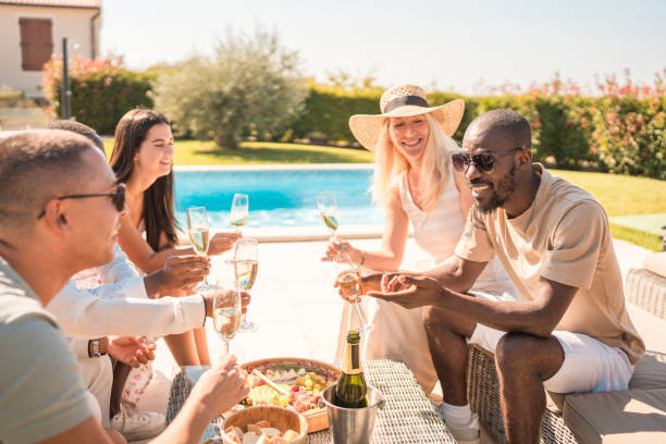 istock Diverse Friends Laughing at Idyllic Villa Poo 2170436927