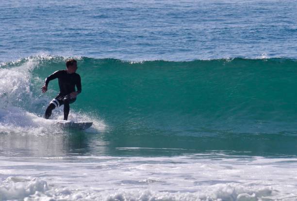 istock Surfer Setting Up his Bottom Turn on a Green Wave in Newport Beach 2170440323