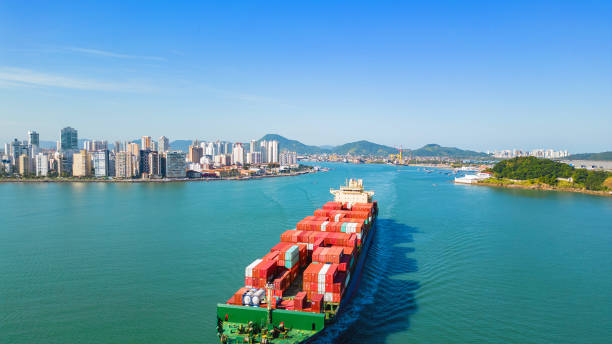 istock Logistics ship and city in the background 2170441118
