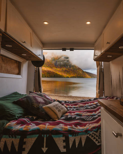 Camper Van Interior Vanlife Doors Open Autumn Scene Lake Camping Colorful Fall Foliage. Bed Blanket Digital Nomad Pillows Custom Build Beautiful View