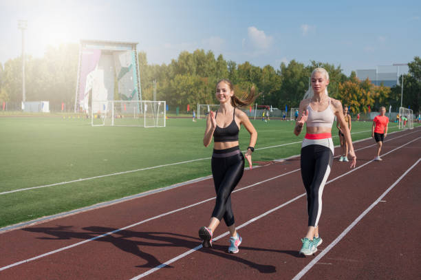 istock Two athlete young woman runner at the stadium 2170443858