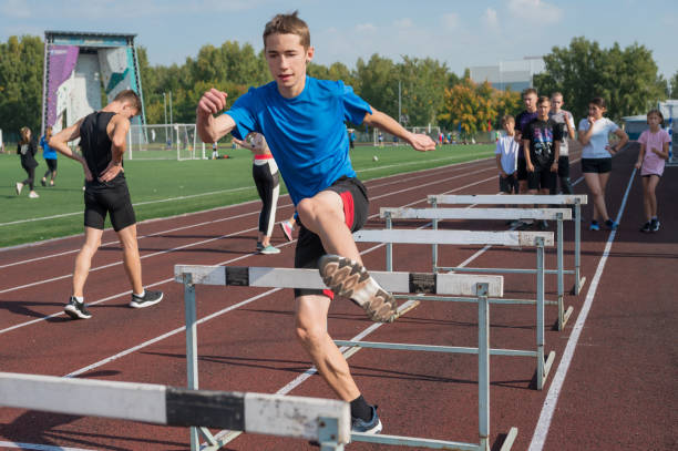 istock Group of young athletes training at the stadium 2170443866