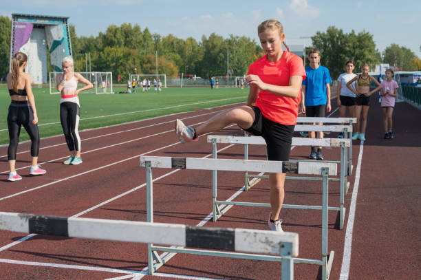 istock Group of young athletes training at the stadium 2170443871