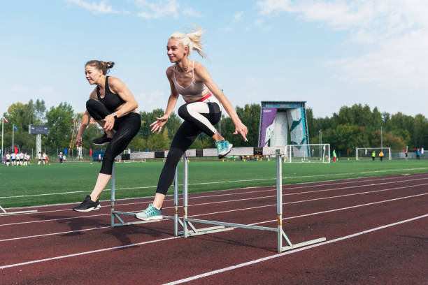 one african runner running hurdlers hurdling  woman isolated on white background silhouette