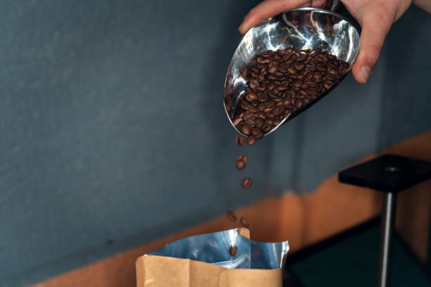 istock The man is packaging roasted coffees ready for sale. 2170443957