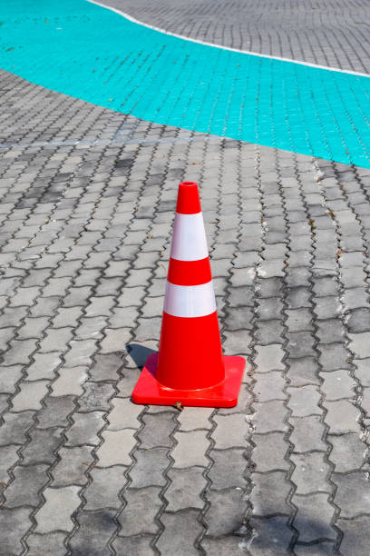 istock Traffic cone on paving stones. Traffic restriction 2170445495
