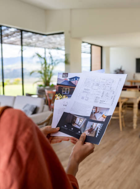 istock Client buying a house and looking at a brochure 2170446106