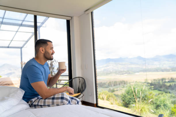 istock Man drinking a cup of coffee in the morning 2170446108