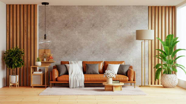 istock Living room wall mockup with leather sofa and decor on concrete background- 3D rendering 2170450629