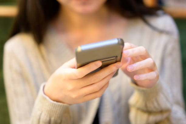 istock A young woman watching review video before making payment in her e-commerce platform 2170454839