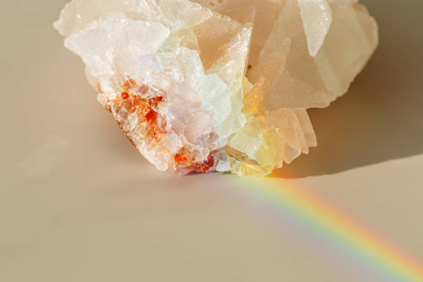 istock Quartz Prism's Rainbow Reflection at sunlight, close up of clear quartz crystal captures prismatic rainbow, natural facets and beauty of mineral. Minimal aesthetic nature pattern, beige pastel tone 2170456594