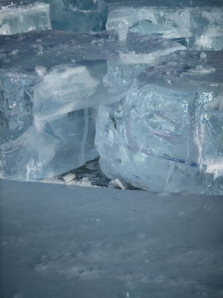 istock Transparent solid thick ice cube cross section texture frozen water glacier iceberg closeup view 2170456644