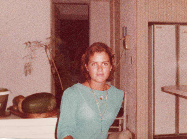 istock Image taken in the 70s: Pensive young woman posing inside her home kitchen 2170456739