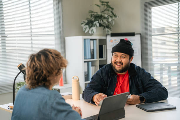 istock Confident Young Asian Candidate talking with Interviewer in office. 2170458495