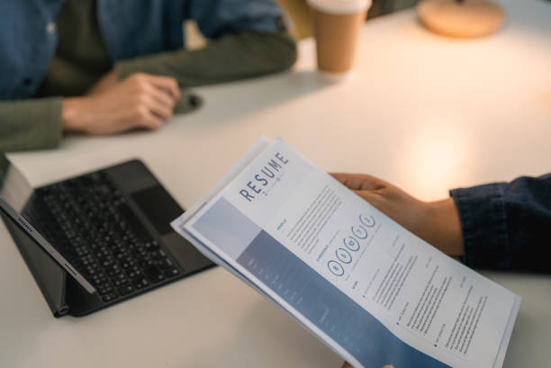 istock Young Asian Candidate Giving a Resume to interviewer while Job interview at office. 2170458503