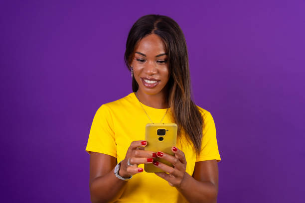 istock A beauty african woman using mobile phone 2170462398