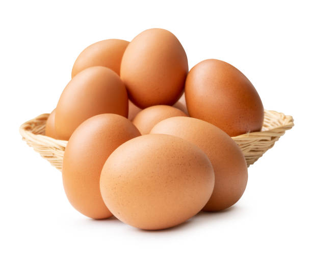 istock Group of fresh brown chicken eggs in stack in wicker basket isolated on white background with clipping path 2170464900