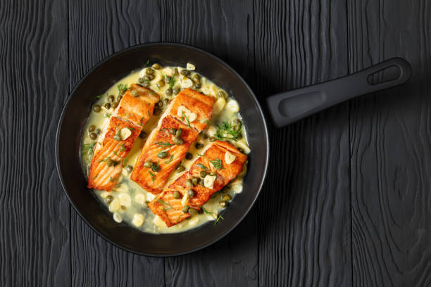 istock salmon piccata with lemon caper sauce in a pan 2170464958