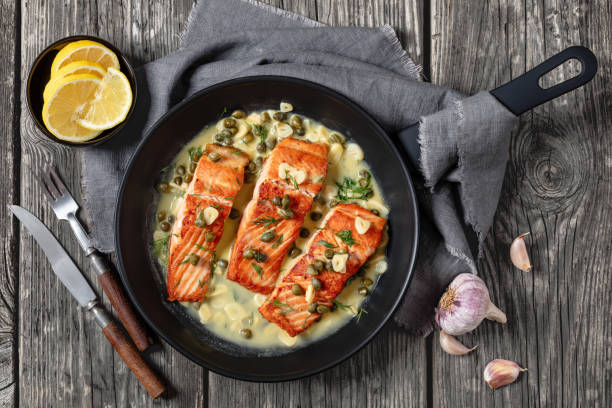 istock salmon piccata with lemon caper sauce in a pan 2170464960