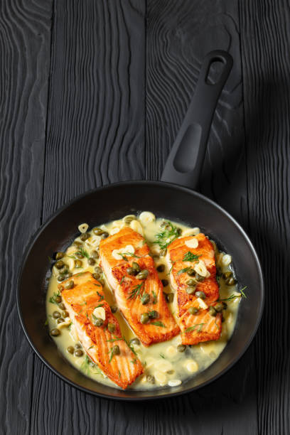 istock salmon piccata with lemon caper sauce in a pan 2170464961
