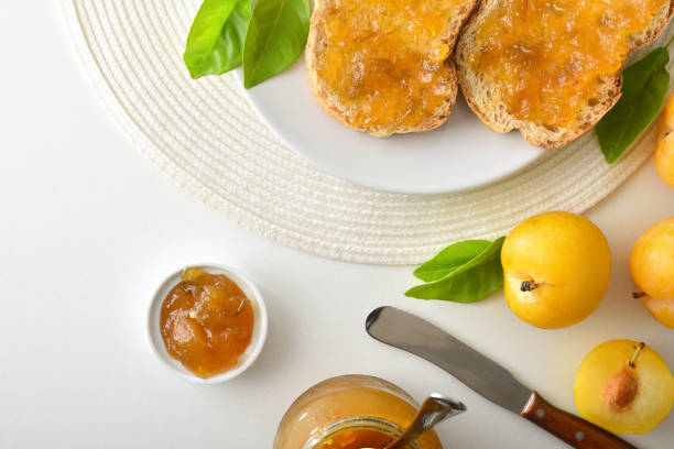istock Kitchen bench with breakfast prepared with plum jam on toast 2170467032