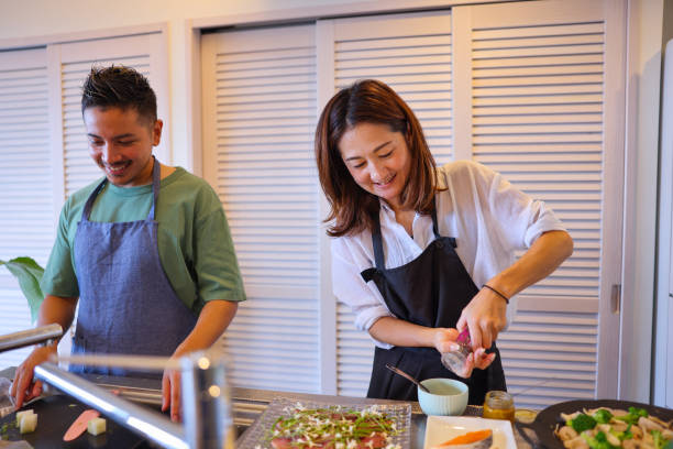 istock Family Prepare For Meal 2170469009