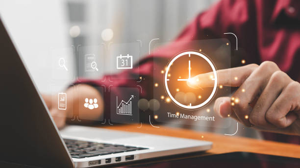 istock Time management concept, businessman holding clock and money icon on interface virtual for business time management. time is money, work planning increases efficiency and reduces work time. 2170469205