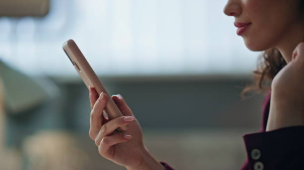 istock Freelancer hands scrolling smartphone in home office. Relaxed girl browsing web 2170469757