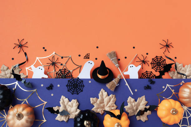 istock Halloween party decorations from pumpkins, bats, spider web top view. Happy halloween holiday greeting card flat lay. 2170471647