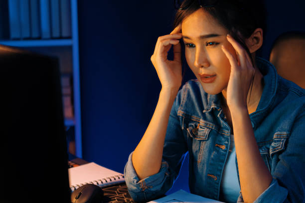 istock Stressful asian creative looking on pc to search project creator. Stratagem. 2170471814