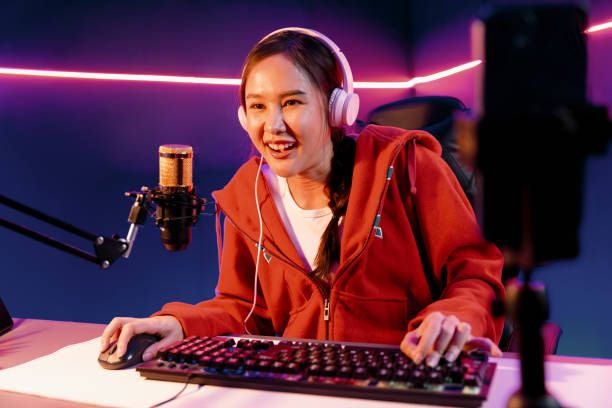 istock Host channel smiling Asian wearing headphone recording on phone. Stratagem. 2170473639
