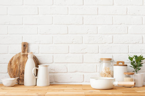 istock Food and kitchen accessories on wood table over white brick wall background 2170473785