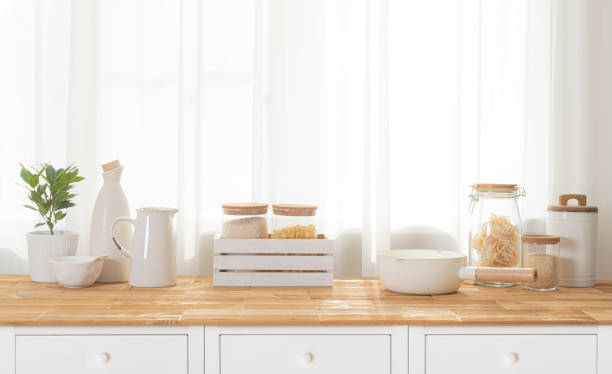 istock Various food ingredients and kitchen items on table over window curtain in daylight 2170473797