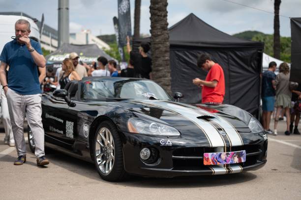 Mataro, Spain – July 07, 2024: second generation Dodge Viper ZB I, There are many people and public looking and taking photos. An older man with sunglasses appears to be the owner