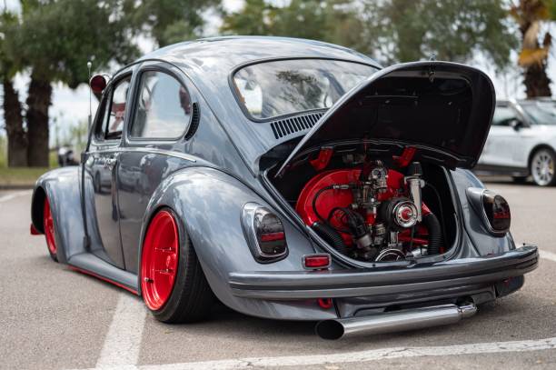 Mataro, Spain – July 07, 2024: Rear view classic Volkswagen Type 1 nicknamed Beetle with the hood open, the engine is an air-cooled boxer with a skull and a transverse exhaust pipe