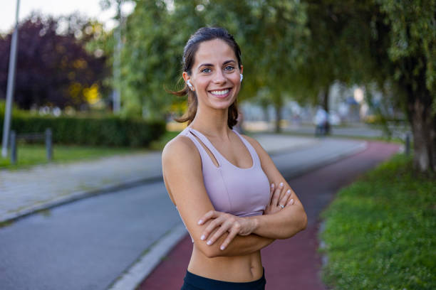 istock Confident Woman Smiling Outdoors in Athletic Wear 2170474888